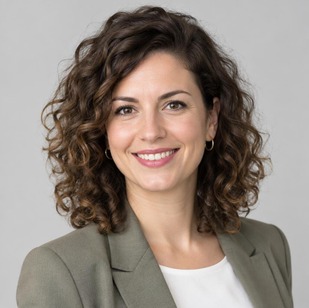 Portrait of a European woman with curly hair in business attire